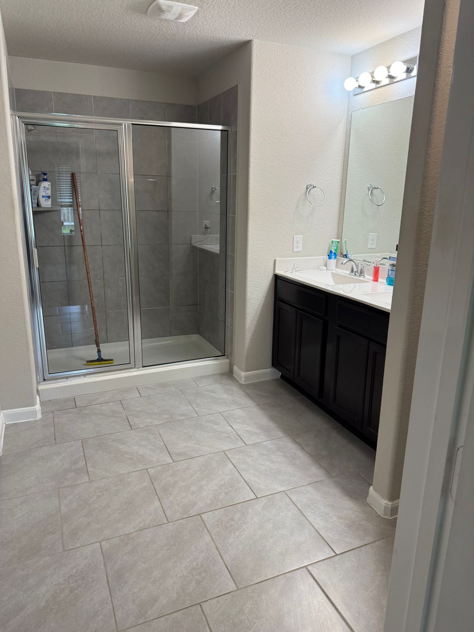 Gleaming bathroom fixtures and mirrors after professional cleaning
